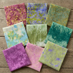 Nine Mariposa Grove batik half-metre fabrics in pink purple green teal blue and lilac floral and double-border designs for quilting and patchwork