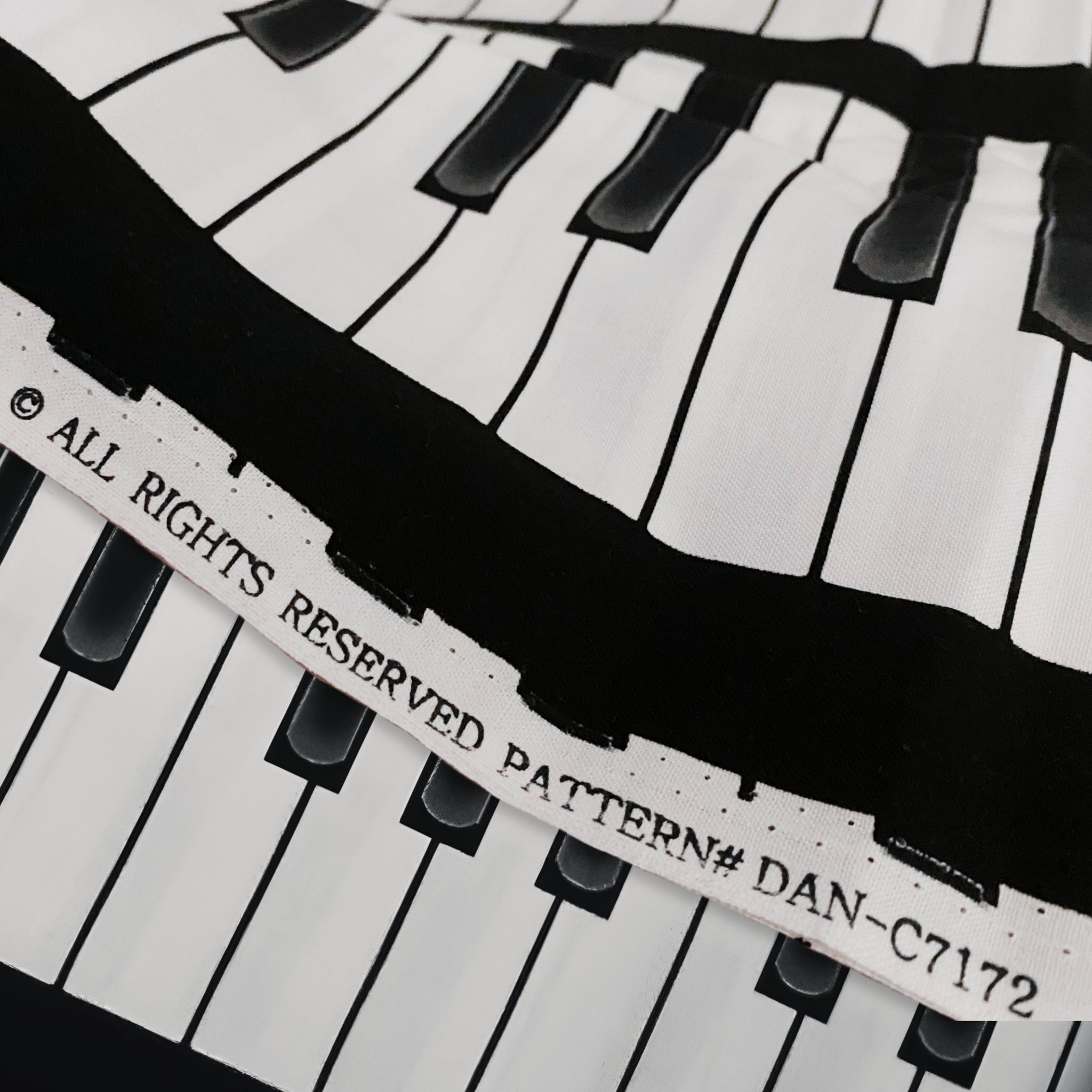 Timeless Treasures selvedge grand piano keys black white music fabric Dan Morris DAN-C7172