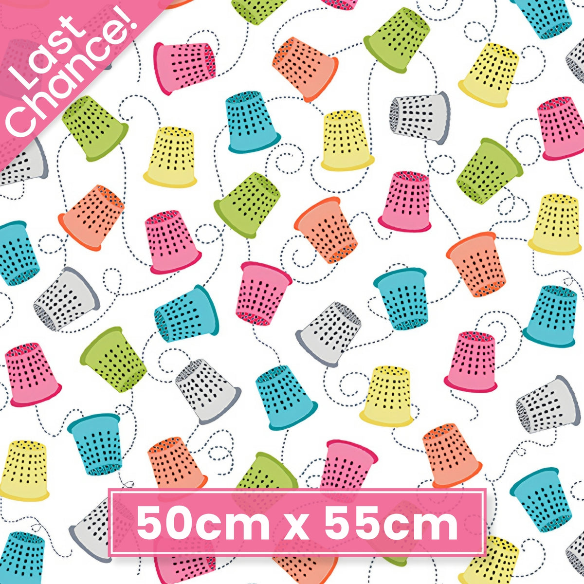 Colourful thimbles pink teal lime yellow orange dashed stitch lines white novelty sewing fabric for quilts craft room cushions tote bags zip pouches patchwork projects