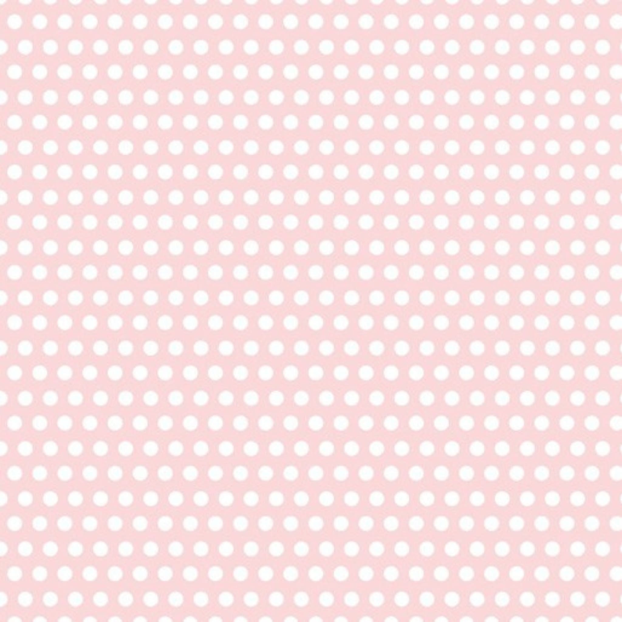 White dots on pale pink quilting cotton patchwork fabric blender for baby sewing projects