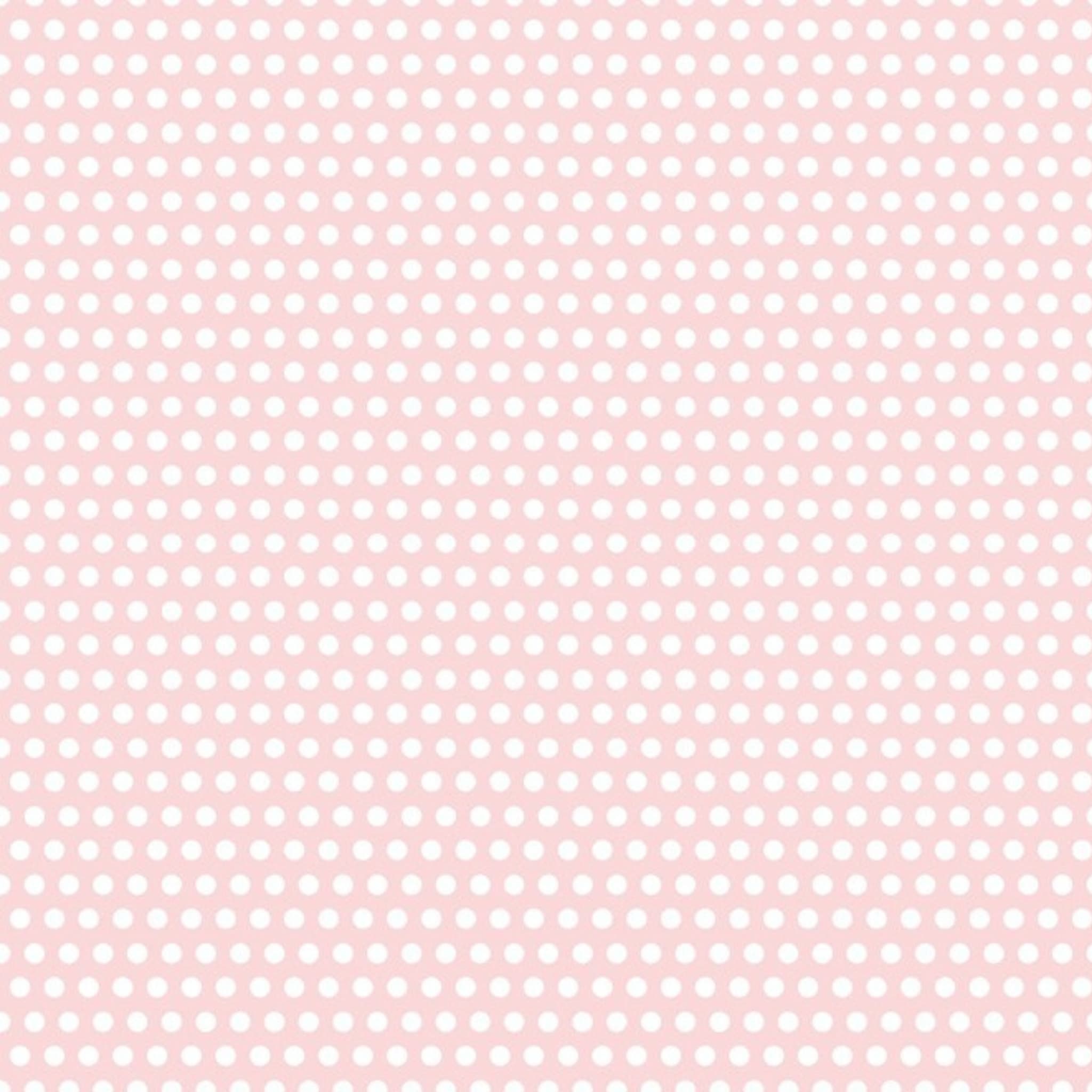 White dots on pale pink quilting cotton patchwork fabric blender for baby sewing projects