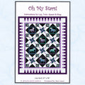 Oh My Stars quilt pattern with framed horses in large star blocks, in purple, black, and teal