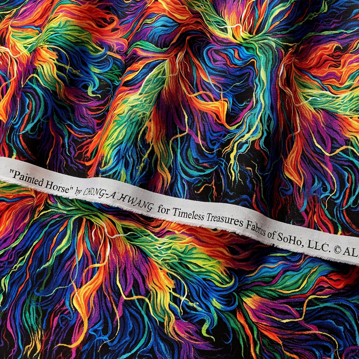 Swirling rainbow horse mane blender orange red pink purple blue green yellow black background digital print fabric for horse quilts feature backgrounds bags and bold patchwork sewing projects