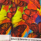 Orange red monarch butterfly print vibrant tropical background for novelty quilting projects