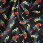 Tossed parrots black background vibrant red yellow blue green tropical novelty quilting fabric
