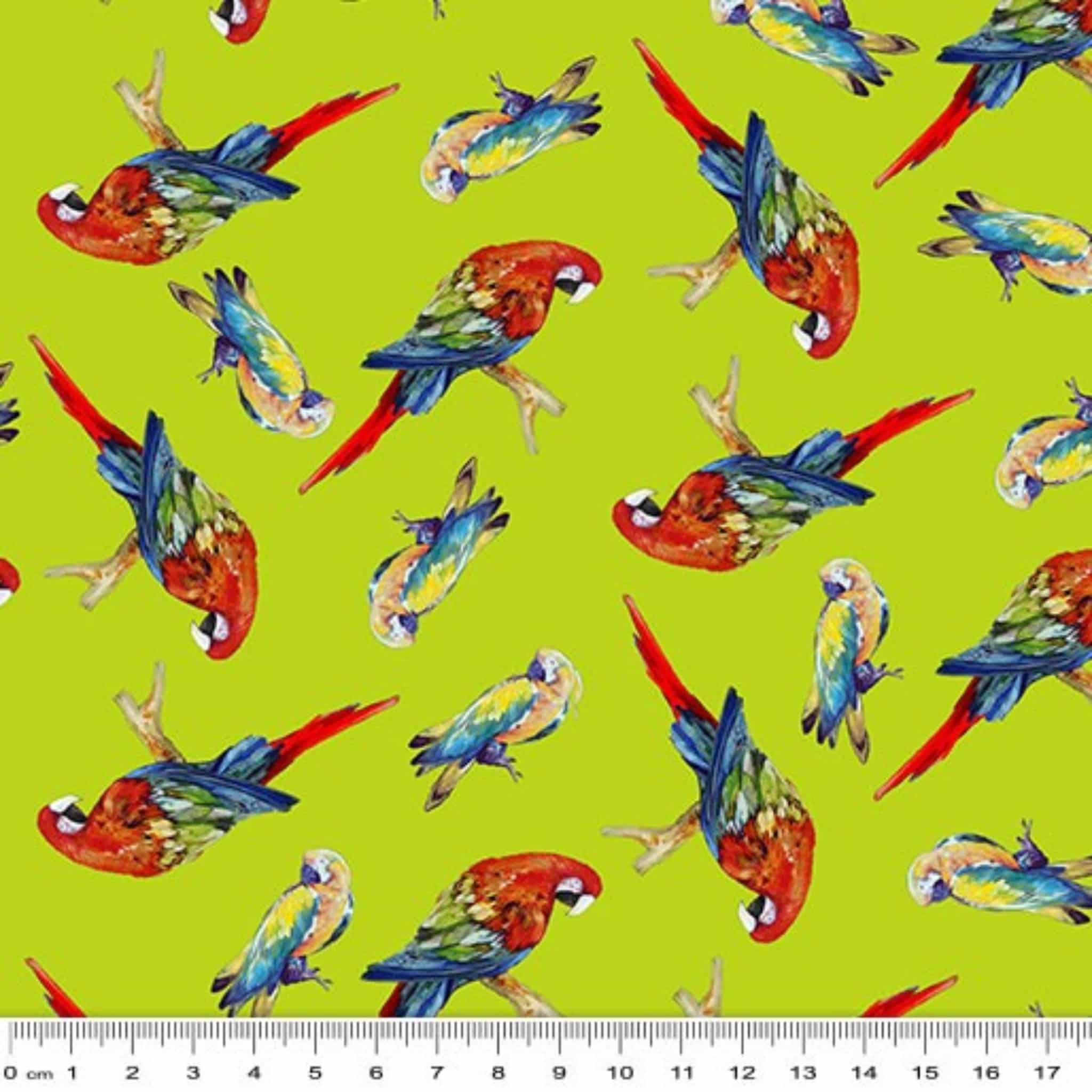 Tossed parrots lime green background vibrant red yellow blue tropical novelty quilting fabric