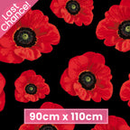 Bold red ANZAC poppies on black quilting cotton fabric for memorial projects