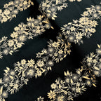 Pearlescent gold floral stripe daisies sunflowers black background fabric for quilt borders sashing cushion covers tote bags jacket linings and vests