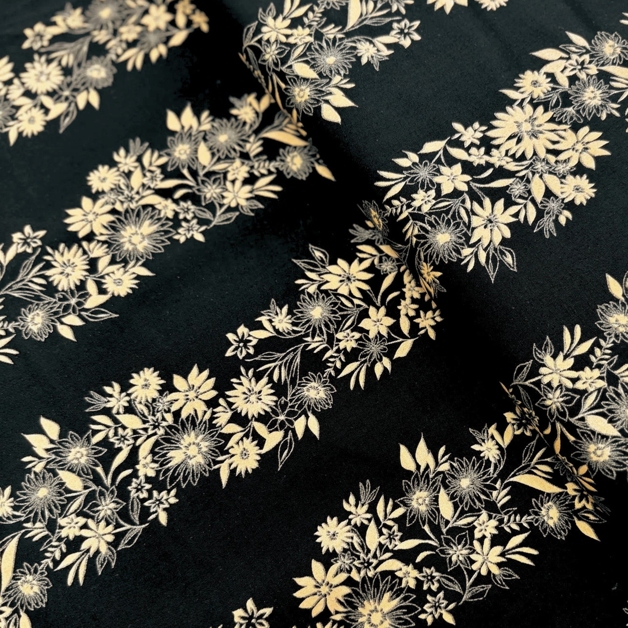 Pearlescent gold floral stripe daisies sunflowers black background fabric for quilt borders sashing cushion covers tote bags jacket linings and vests