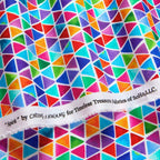 Watercolour rainbow triangle geometric blender red orange yellow green blue purple pink turquoise white background digital print fabric for children's quilts triangle blocks and bags