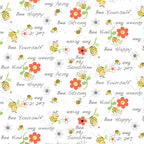 Yellow bees with flowers and Bee Kind words on white fabric for baby quilts nursery decor and children's patchwork sewing projects