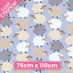 Fluffy stacked white taupe grey sheep varied wool textures periwinkle fabric for baby quilts nursery décor and patchwork sewing projects
