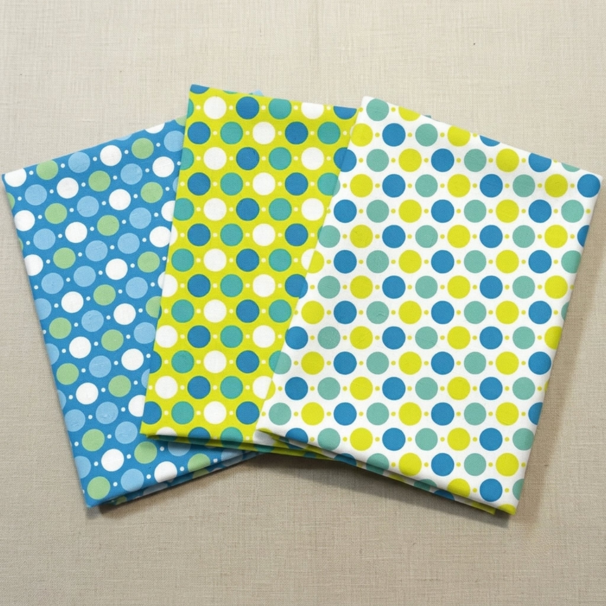 Hop Dot polka dot novelty quilting fabric fat quarters in blue lime and white for kids baby quilts and patchwork projects