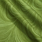 Tonal basil green fabric with an all-over wave and brushstroke pattern, perfect as a quilt blender