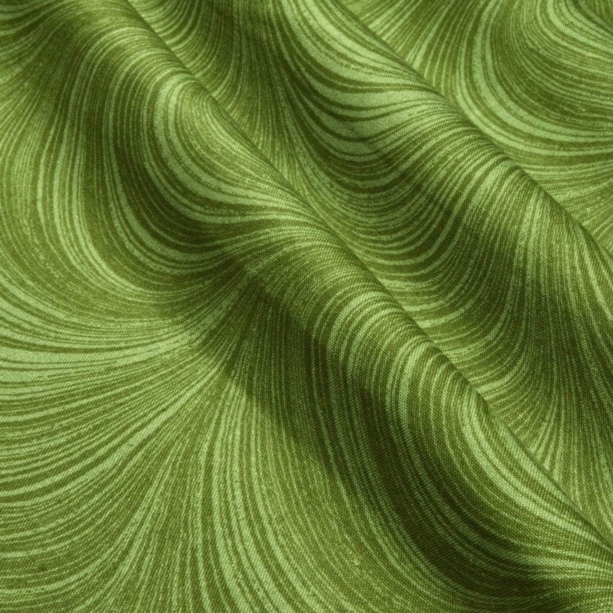 Tonal basil green fabric with an all-over wave and brushstroke pattern, perfect as a quilt blender