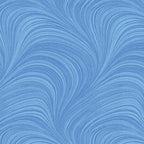 Tonal light blue fabric with an all-over wave and brushstroke pattern, perfect as a quilt blender