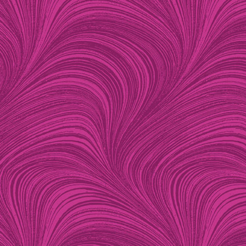 Tonal fuchsia pink fabric with an all-over wave and brushstroke pattern, perfect as a quilt blender