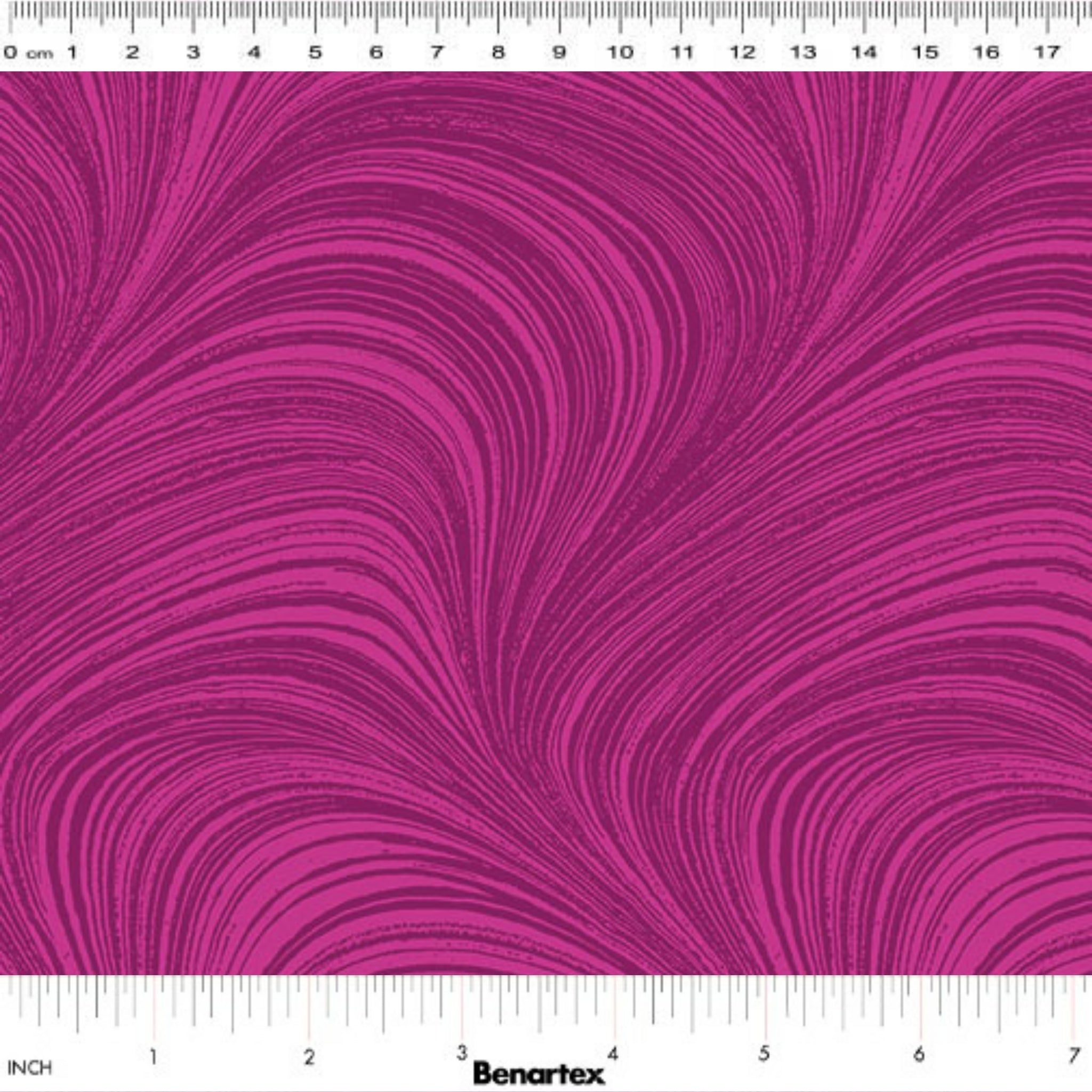 Tonal fuchsia pink fabric with an all-over wave and brushstroke pattern, perfect as a quilt blender