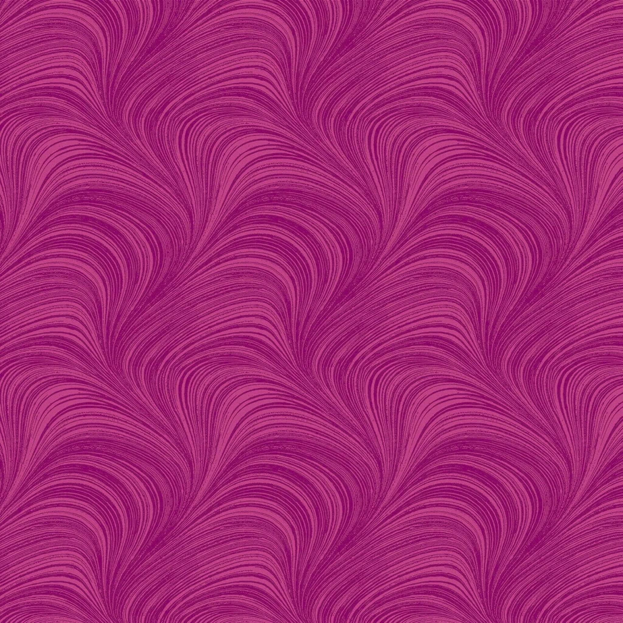 Tonal fuchsia pink fabric with an all-over wave and brushstroke pattern, perfect as a quilt blender