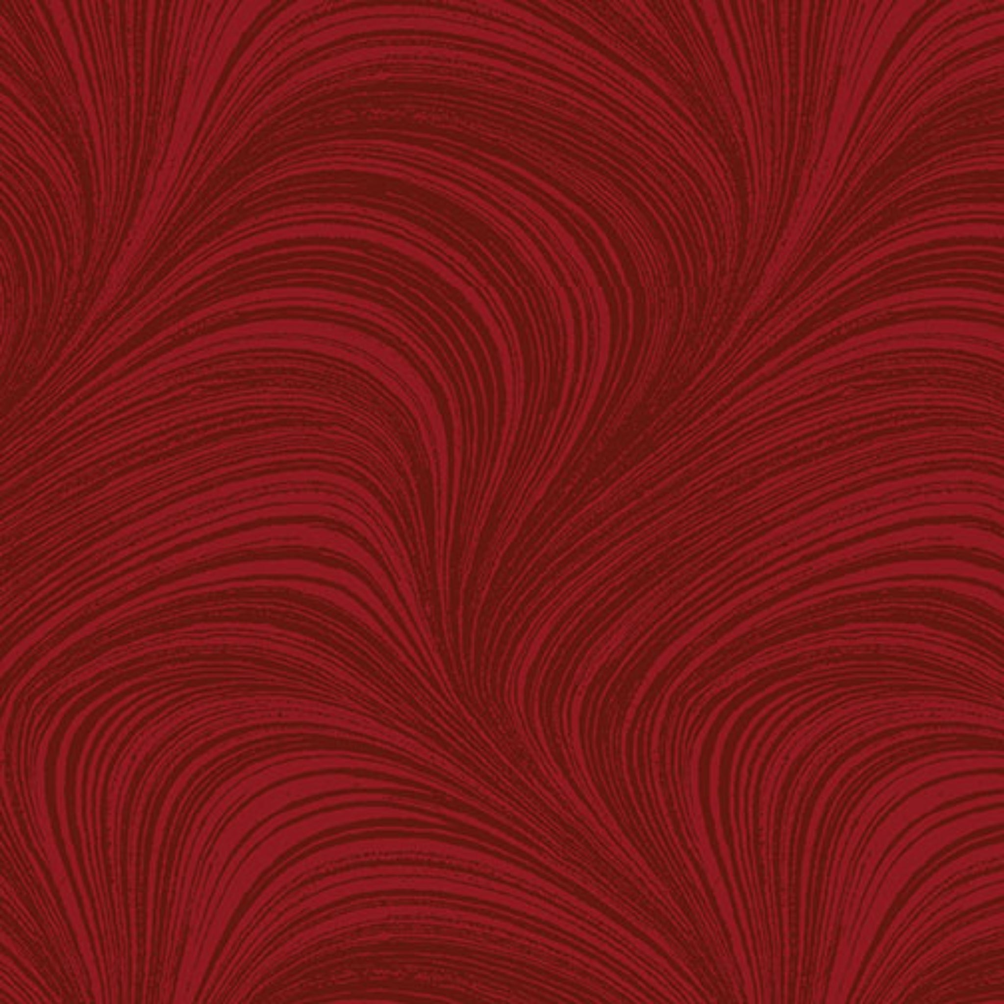 Tonal medium red fabric with an all-over wave and brushstroke pattern, perfect as a quilt blender
