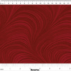 Tonal medium red fabric with an all-over wave and brushstroke pattern, perfect as a quilt blender
