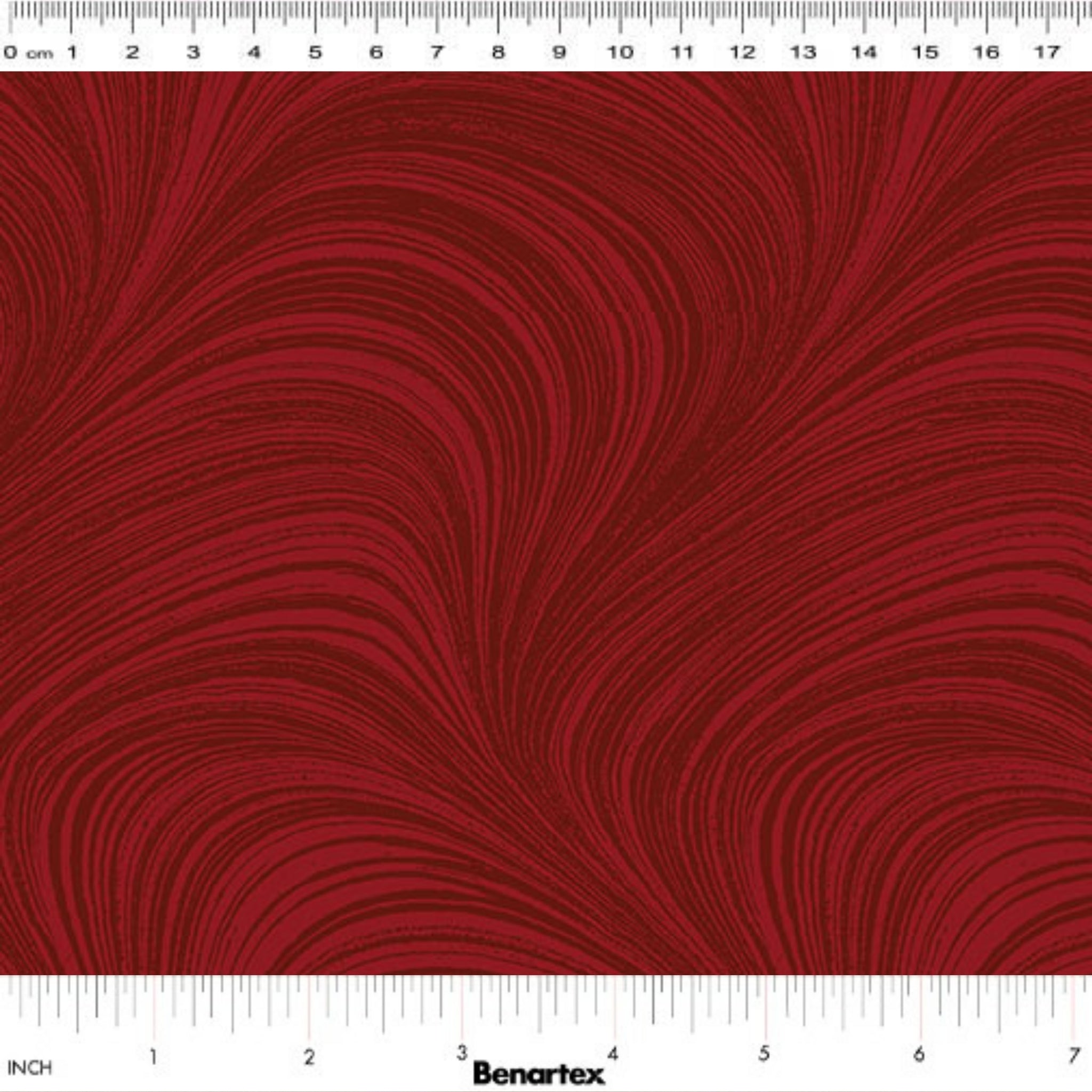 Tonal medium red fabric with an all-over wave and brushstroke pattern, perfect as a quilt blender