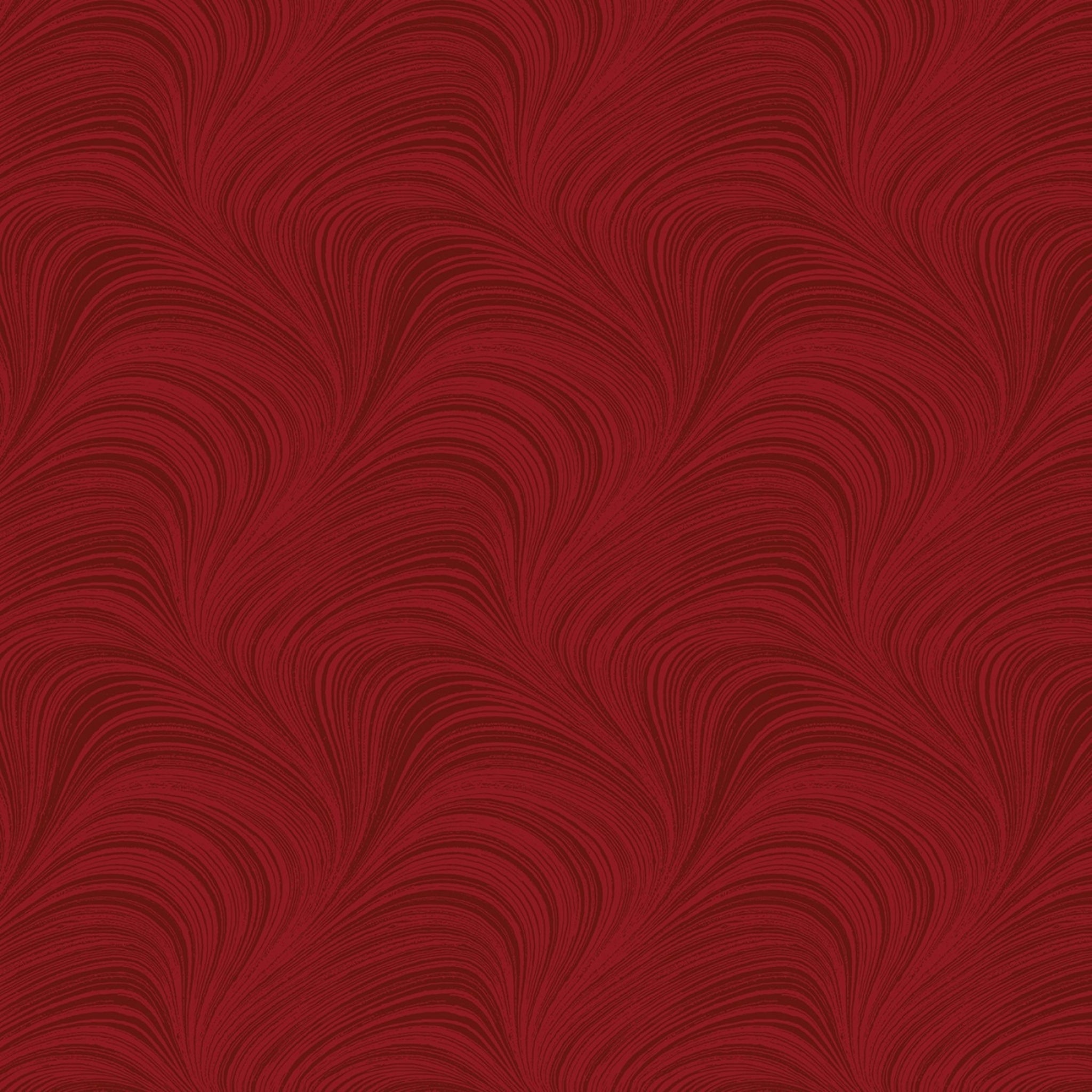 Tonal medium red fabric with an all-over wave and brushstroke pattern, perfect as a quilt blender