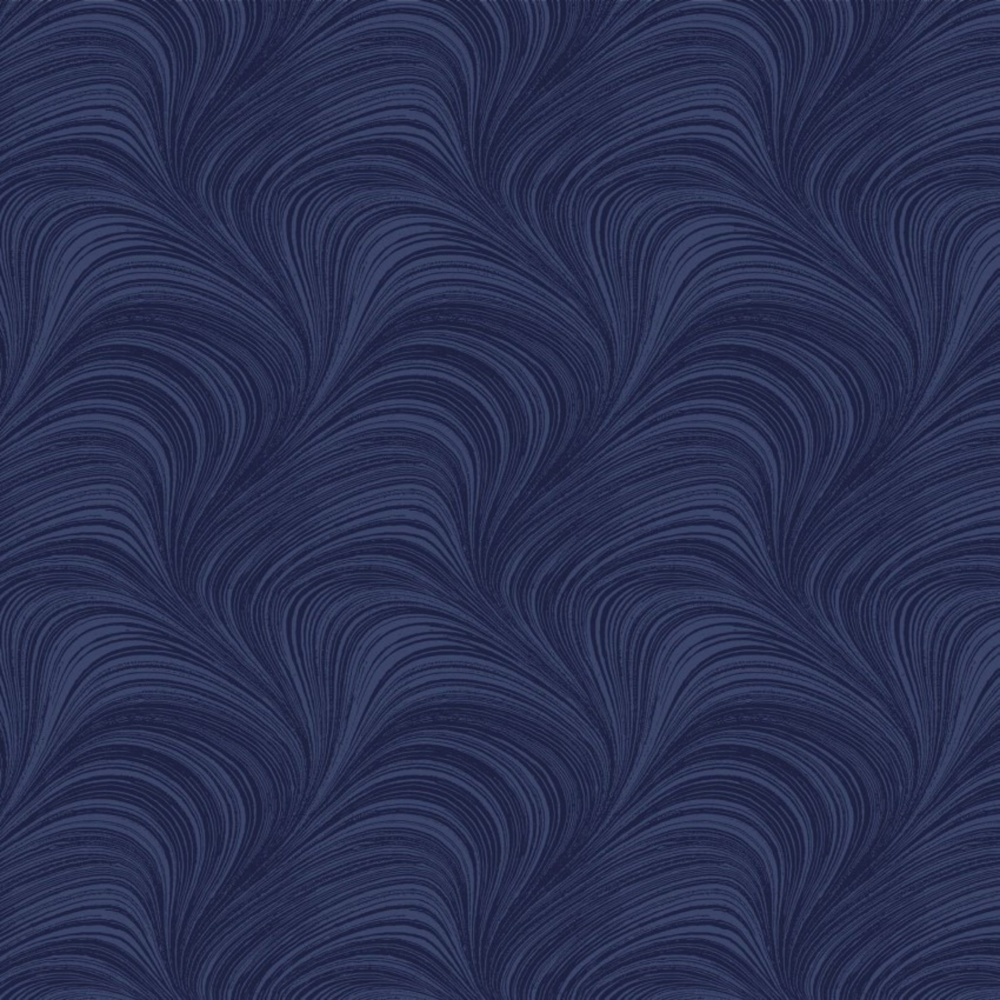 Tonal navy blue fabric with an all-over wave and brushstroke pattern, perfect as a quilt blender