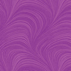 Tonal orchid purple fabric with an all-over wave and brushstroke pattern, perfect as a quilt blender