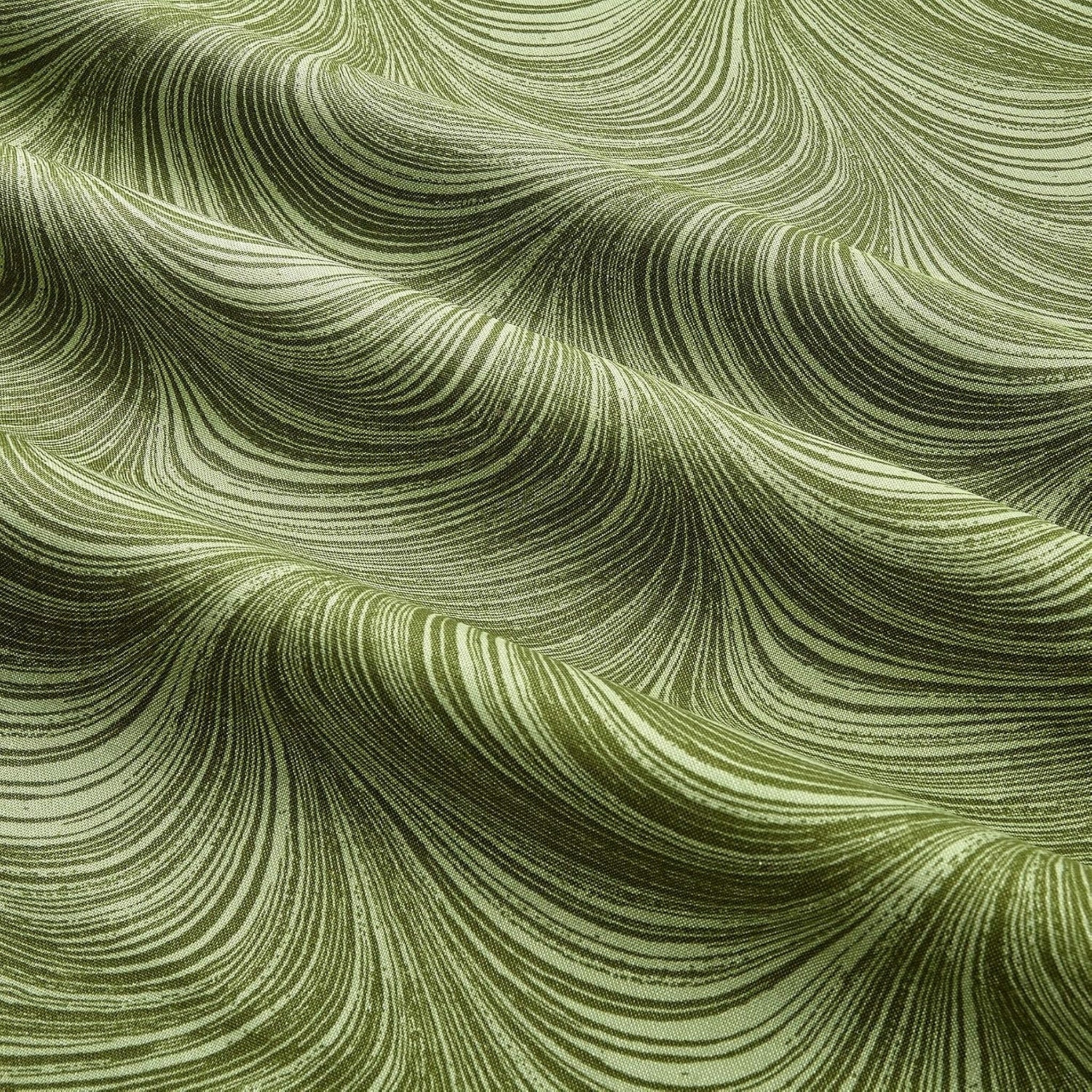 Tonal sage green fabric with an all-over wave and brushstroke pattern, perfect as a quilt blender