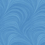 Tonal sky blue fabric with an all-over wave and brushstroke pattern, perfect as a quilt blender