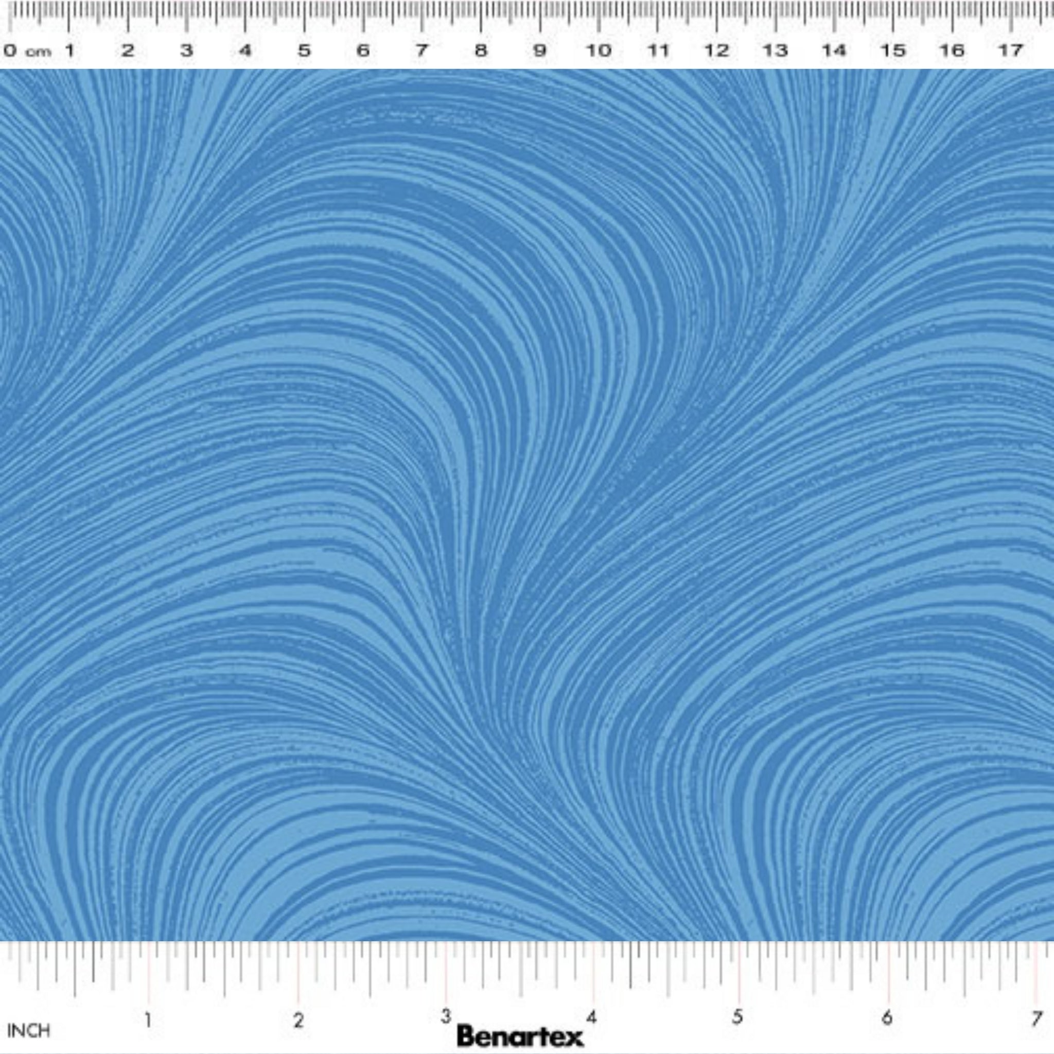 Tonal sky blue fabric with an all-over wave and brushstroke pattern, perfect as a quilt blender