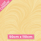 Tonal soft yellow fabric with an all-over wave and brushstroke pattern, perfect as a quilt blender