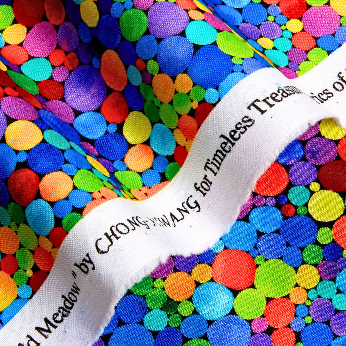 Packed watercolour rainbow spots varying sizes red orange yellow green blue purple pink turquoise black background digital print fabric for feature quilts children's projects and bags
