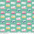 A fabric with a repeating pattern of vintage style campers in various colors including pink, blue, and yellow.