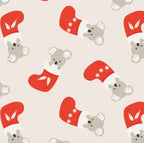 Festive quilting cotton with koalas in red Christmas stockings on cream background