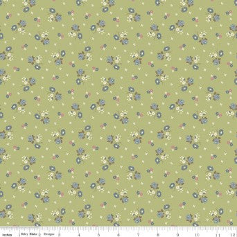 A piece of fabric with a small floral pattern in green, blue, and other colors on a green background.